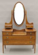 An Edwardian line inlaid mahogany dressing table. 113 cm wide.