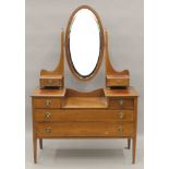 An Edwardian line inlaid mahogany dressing table. 113 cm wide.