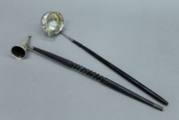 A silver candle snuffer and a Georgian unmarked toddy ladle. The former 34.5 cm long.
