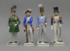 Four Continental porcelain models of soldiers. The largest 23 cm high.