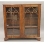 A George III and later glazed mahogany bookcase. 115 cm wide.