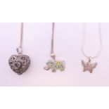 Three silver pendants (heart, elephant and butterfly) on silver chains. Elephant 2.5 x 1.