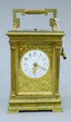 A large Victorian brass cased repeating carriage clock. 18 cm high.