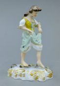A Royal Crown Derby porcelain figure of Stepping Stones, modelled by Edward Drew. 11.5 cm high.