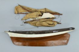 An early 20th century pond yacht hull with some rigging. 57 cm long.