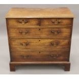 A George III mahogany chest of drawers. 96 cm wide.