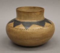 A Shona tribe pottery vase. 13 cm high.