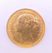 An 1885 gold half sovereign. 4 grammes.