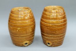 A pair of Victorian pottery spirit barrels. Approximately 33 cm high.