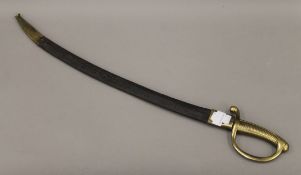 A 19th century brass handled sabre, with leather and brass scabbard. 78.5 cm long overall.