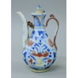 A Chinese red and blue ground porcelain teapot. 21.5 cm high.