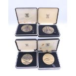 Four boxed Royal Mint bronze medals from The Wildlife Series.