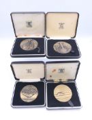 Four boxed Royal Mint bronze medals from The Wildlife Series.