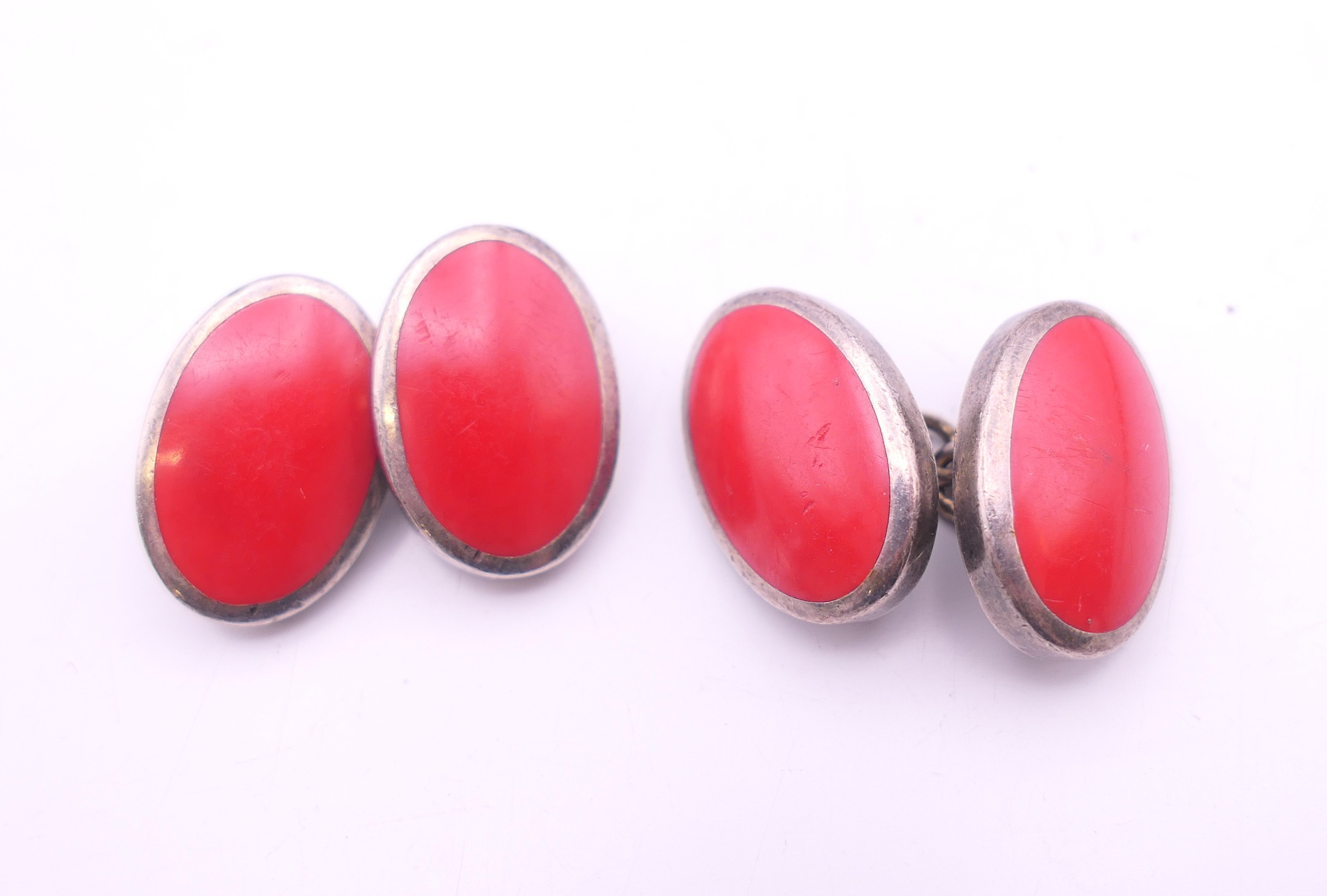 A pair of silver hallmarked cufflinks and a pair of red enamel cufflinks. - Image 5 of 6