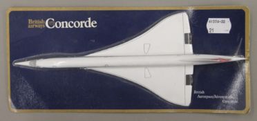 A British Airways Concorde model in original packaging. 26 cm long overall.