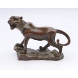 A bronze model of a tiger. 5.5 cm high, 6.5 cm long.