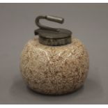 A vintage inkwell formed as a curling stone. 6 cm high.