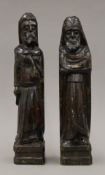 A pair of carved wooden figures. 38 cm high.