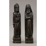 A pair of carved wooden figures. 38 cm high.