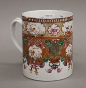 An 18th century Chinese Export tankard. 13 cm high.