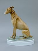 An Art Deco Zsolnay porcelain model of a greyhound. 25 cm high.