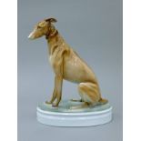 An Art Deco Zsolnay porcelain model of a greyhound. 25 cm high.