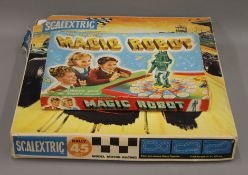 A vintage boxed Magic Robot game and a vintage Scalextric set.