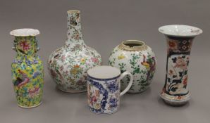 A quantity of Oriental ceramics, comprising a 'Famille Jeaune' vase together with a globular vase,