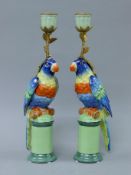 A pair of parrot form porcelain candlesticks. 31.5 cm high.