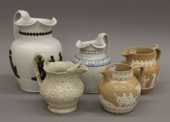 Five 19th century pottery jugs. The largest 23 cm high.