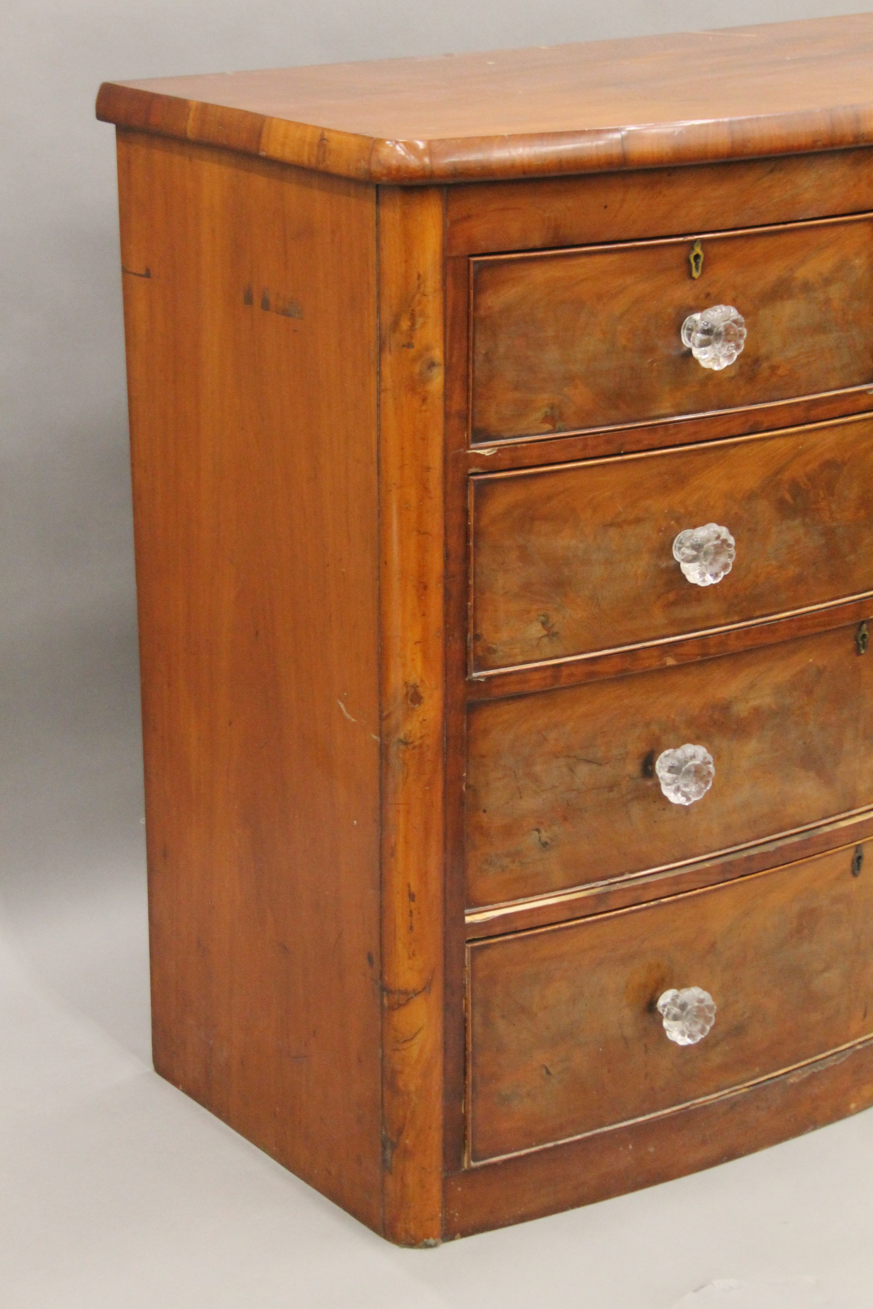 A Victorian mahogany bow front chest of drawers. - Image 2 of 9