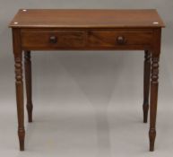 A Victorian mahogany two drawer side table. 86 cm wide, 47.5 cm deep, 76.5 cm high.