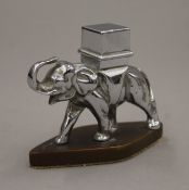 A chrome table lighter in the form of elephant. 8 cm high.