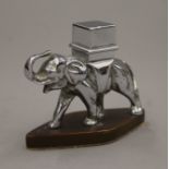 A chrome table lighter in the form of elephant. 8 cm high.