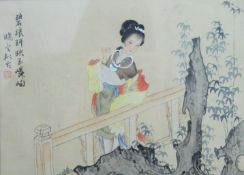 An Oriental watercolour on silk, Woman in a Garden, framed and glazed. 27.5 x 20 cm.