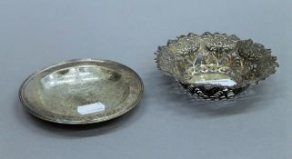 A pierced silver bon bon dish and another small silver dish. The former 12 cm diameter. 117.