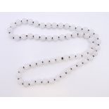 A string of white jade beads. 70 cm long.