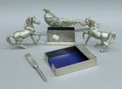 Two silver plated horses, a silver plated pheasant and a desk set.