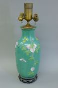 A Chinese green porcelain vase, mounted as a lamp. 64 cm high overall.