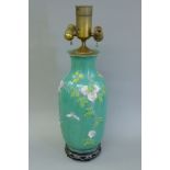 A Chinese green porcelain vase, mounted as a lamp. 64 cm high overall.