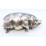 A silver model of a pig, bearing Russian marks. 7 cm long.