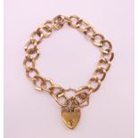 A 9 ct gold bracelet with heart shape padlock. 19 cm long. 21.1 grammes.