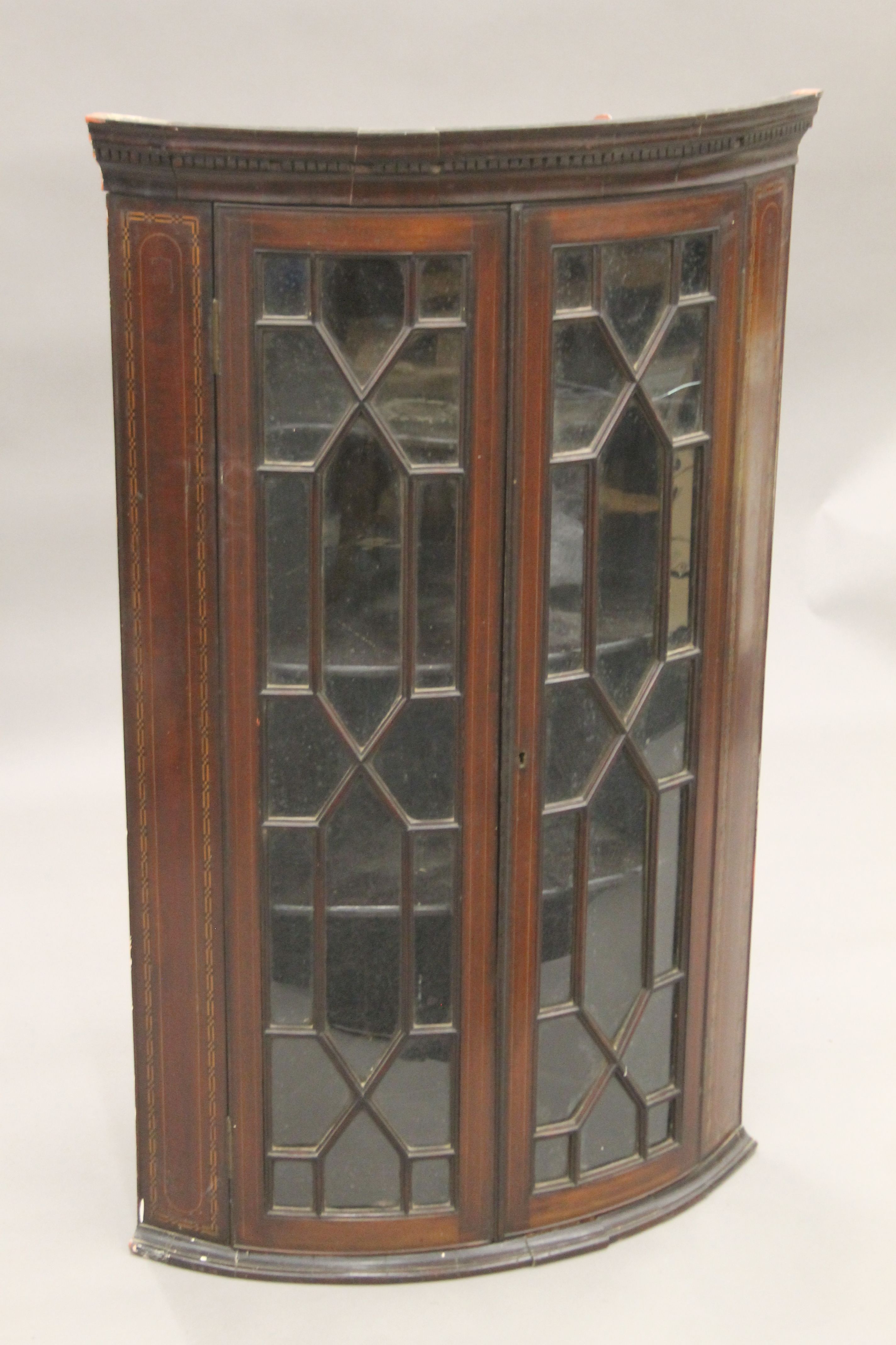 A George III inlaid mahogany glazed hanging corner cabinet. 69 cm wide. - Image 2 of 5