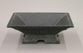 A Chinese patinated bronze censer. 13 cm wide.