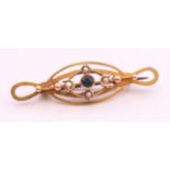 A 9 ct gold bar brooch decorated with a sapphire and seed pearls. 4.5 cm long. 2.