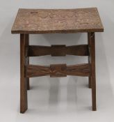 An Eastern carved side table. 59 cm wide.