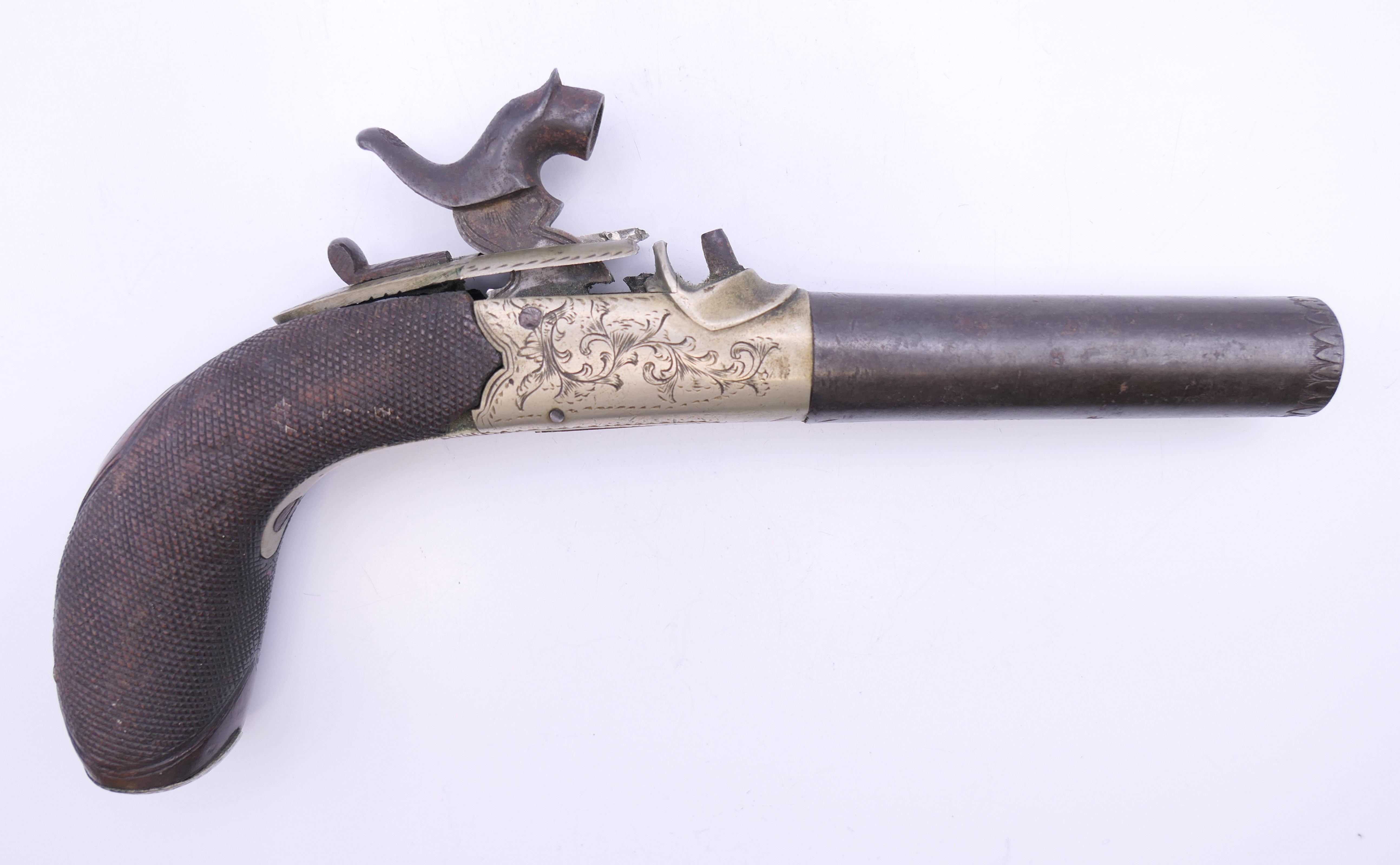 A 19th century percussion pistol. Approximately 18 cm long.