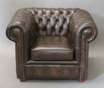 A Chesterfield type armchair. 98 cm wide.