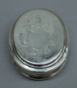 A Queen Anne silver dry fruit or snuff box, with engraved lid, makers mark of C.O, London 1712. 9.