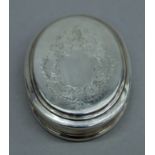 A Queen Anne silver dry fruit or snuff box, with engraved lid, makers mark of C.O, London 1712. 9.